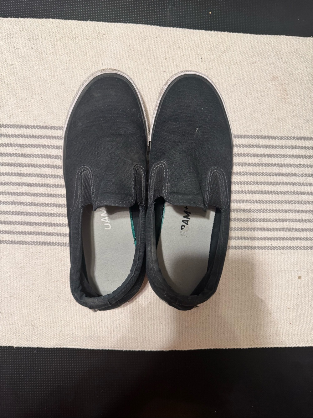 Woman’s Black Slip-On Canvas Shoes